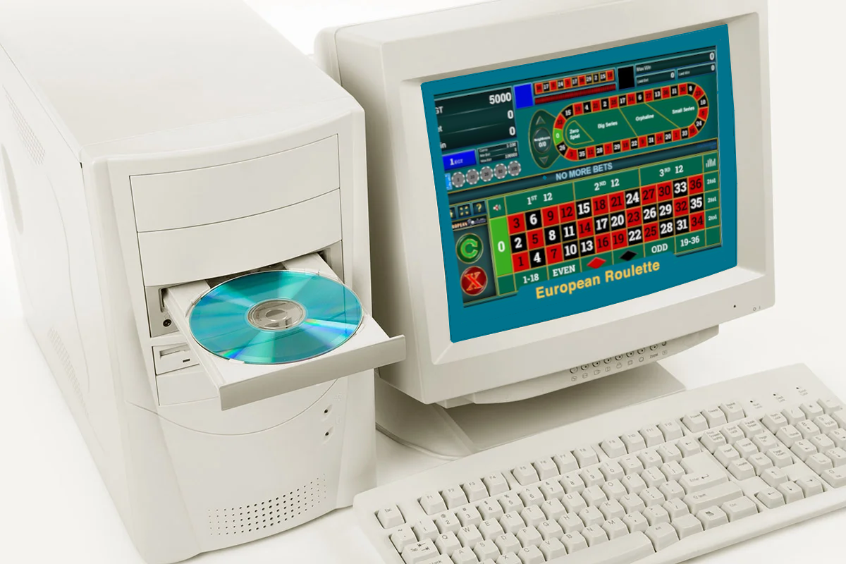 An old-fashioned desktop PC from the 1990's with CD drive open and European roulette shown on the computer screen